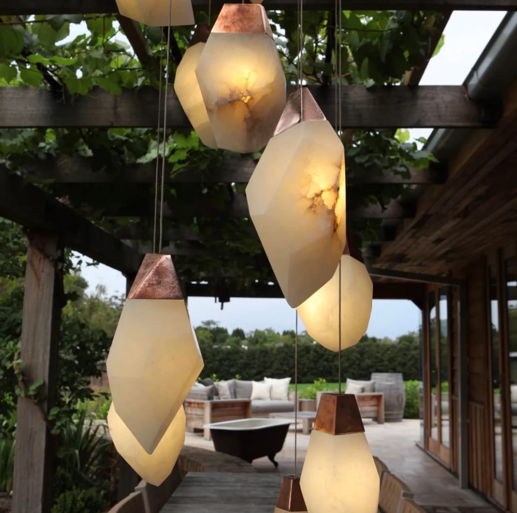 Glowing alabaster lights with copper tops look beautiful in any home space.
