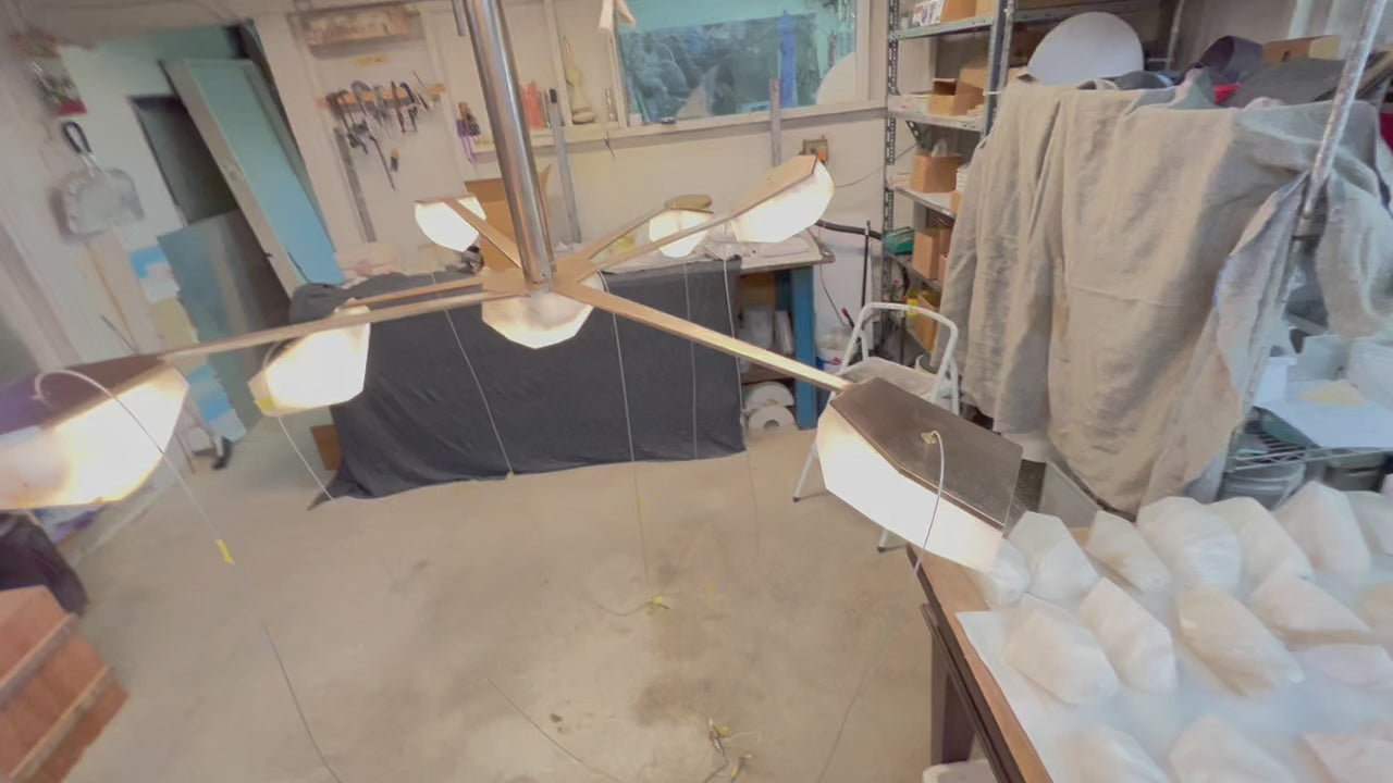 This stone light was is a steel frame and sprayed with bronze, then polished to perfection.