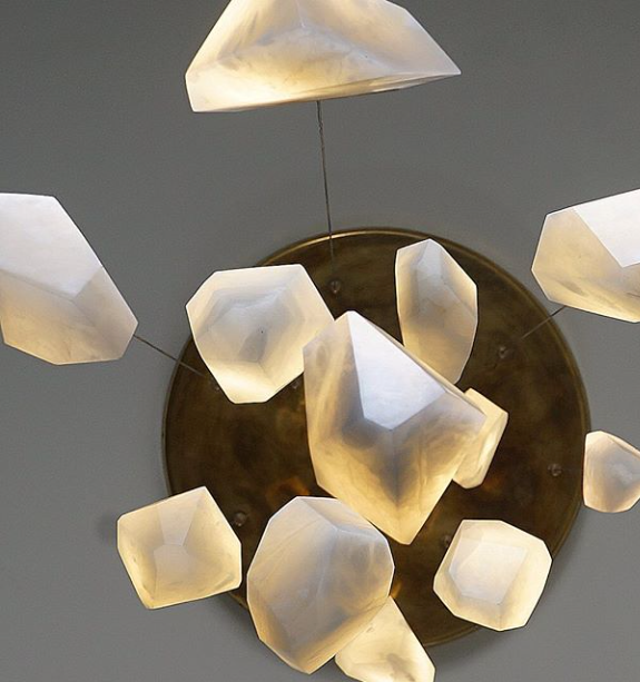 Fathom Stone Art alabaster light collection shows so many different ways to hang the lights. This light grouping is hung from one giant antiqued bronze canopy