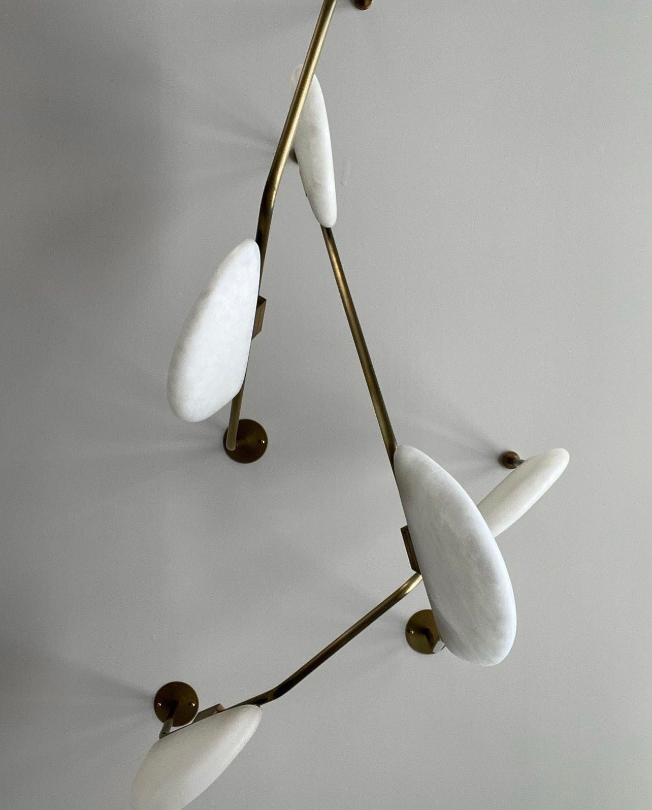 The endless variety of placement and angles of this light make these art lights different with every fixture. One of a kind lights are the style of the room.