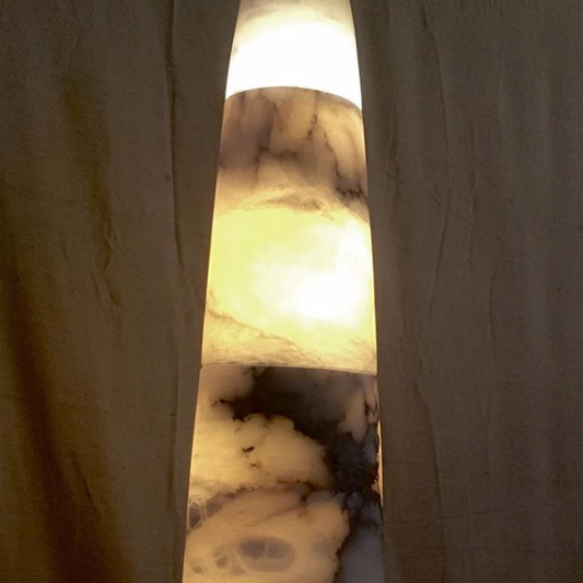 This multi stone alabaster rocket light looks like it might launch to Mars from SpaceX headquarters. 