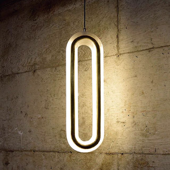 This alabaster long oval light looks like it's was a circle and dripped down over time.  This stone light draws an eye and then a hand.  You just have to touch these to discover the stone.