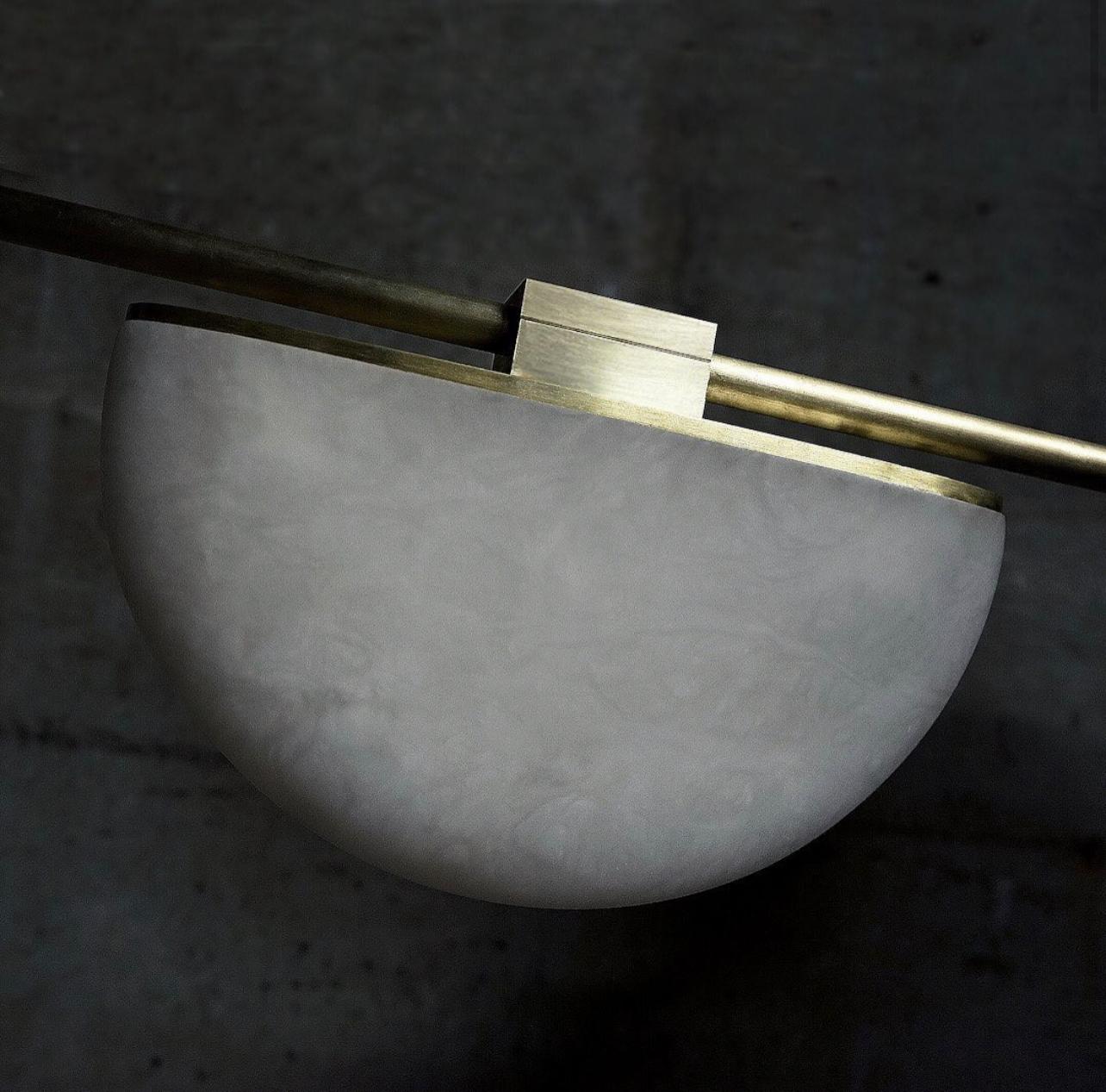 The alabaster stone on this perfectly polished brass contract is beautiful with the light on or off.