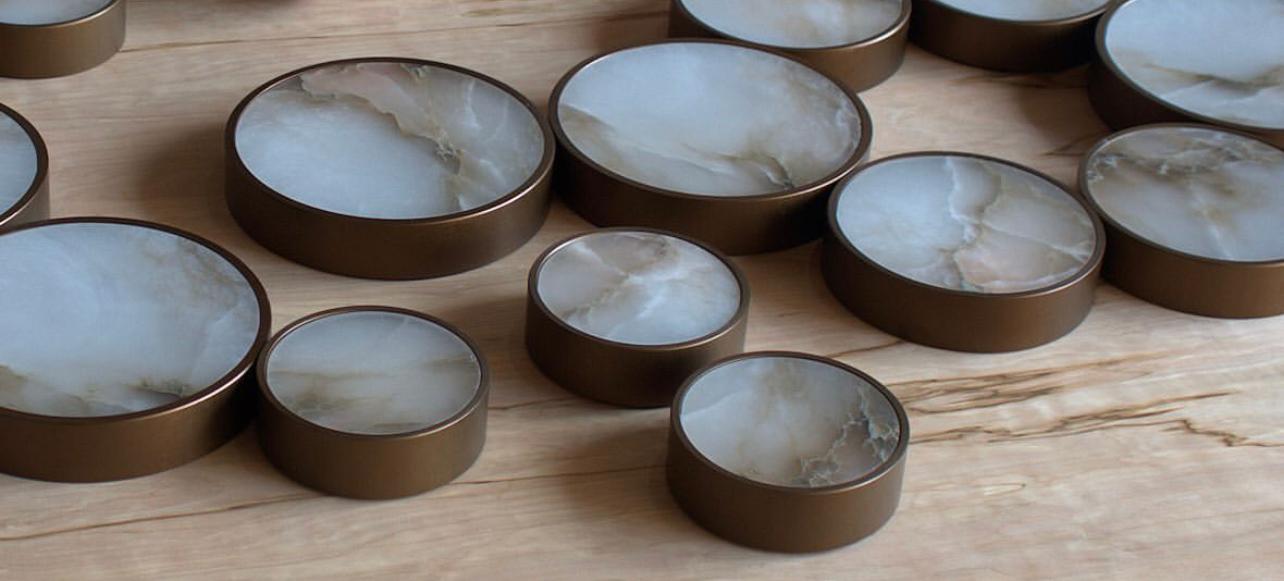 This bronze color light matches the natural veining in these alabaster lights.  Randy Zieber lights at Fathom Stone Art are handmade in Vancouver, BC.