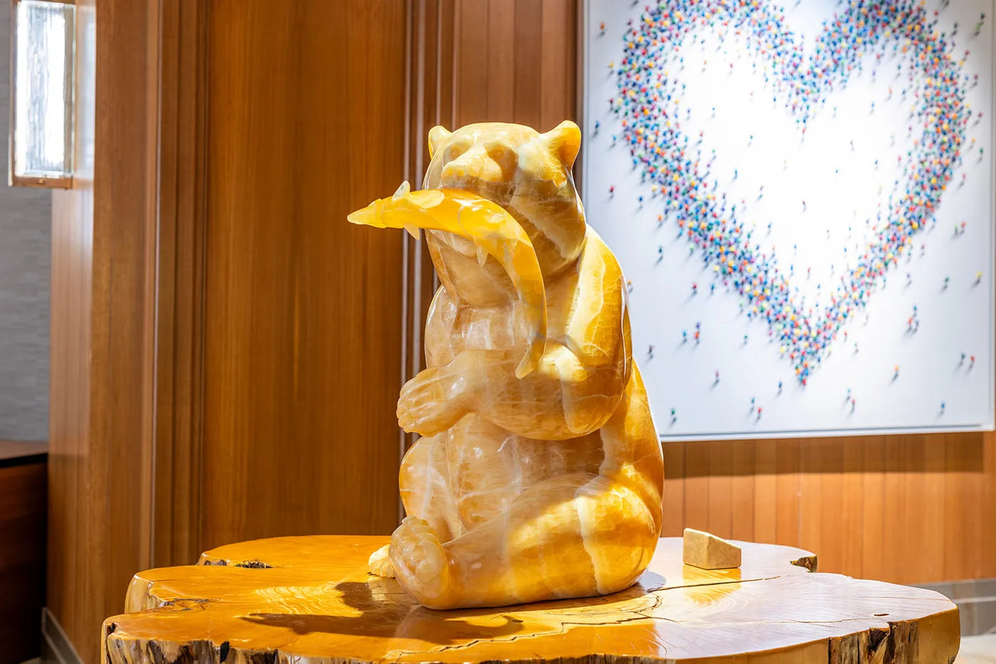 Gold Rush, a golden stone grizzly sculpture displayed at Four Seasons Resort Whistler
