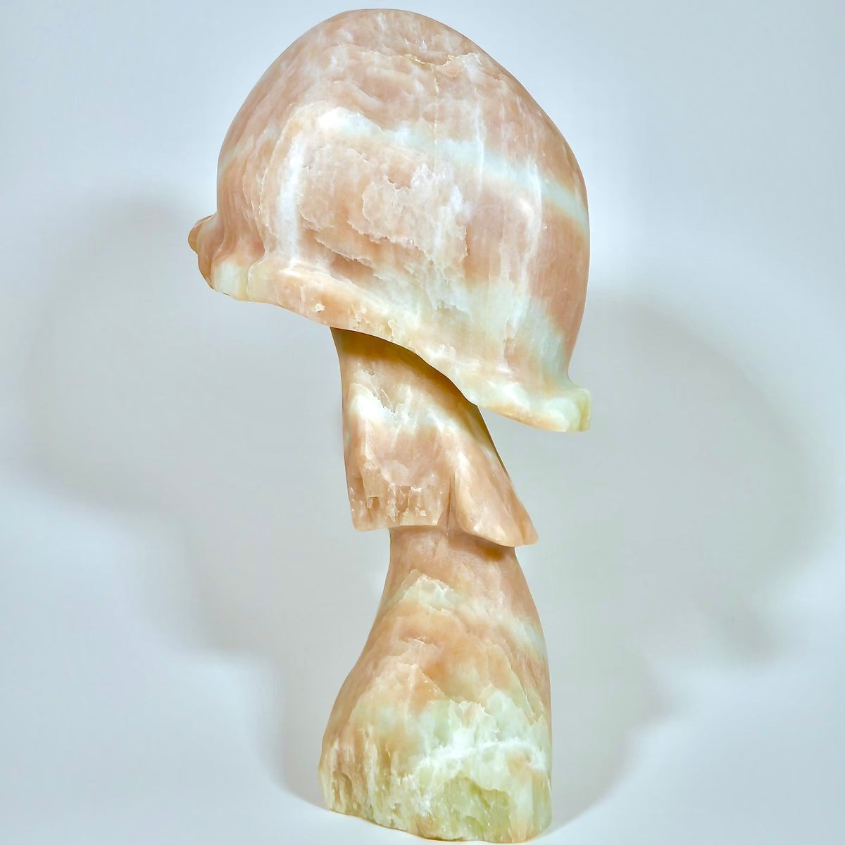 Whistler Canada Stone Sculpture hand carved alabaster pink stone art.  Fathom Stone art showcases the finest Canadian stones and artists.   