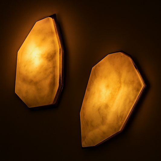 Introducing our new Alabaster Sconce Light - a unique, bespoke luxury addition to any home. Each piece is hand carved from high-quality alabaster and brass, creating a one-of-a-kind statement piece. With its elegant design, this sconce light adds style and sophistication to any room. Plus, at just 4 lbs, it's lightweight and easy to install. Made in Vancouver, BC, this sconce light blends luxury and craftsmanship for a truly stunning addition to your home.