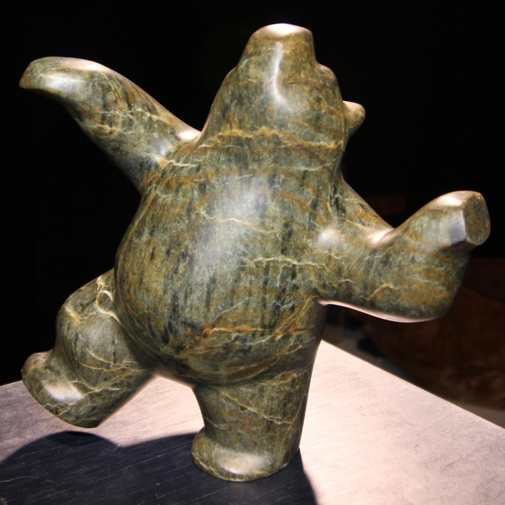Dancing green, grey soapstone bear, winter, summer activities.