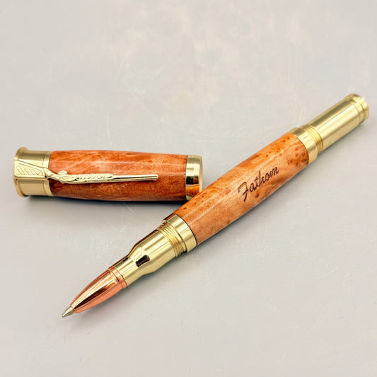 Wooden pen with gold accents on a light gray background