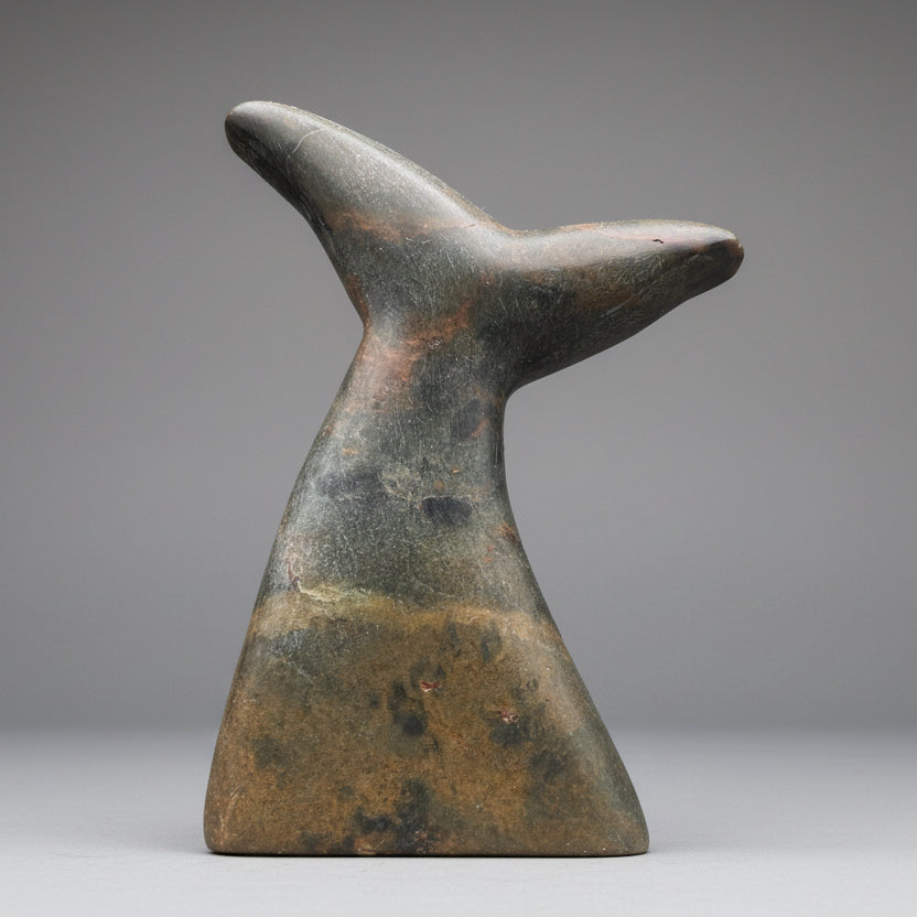 Stone sculpture of a orca tail crafted during a creative bridesmaid or bachelor party activity — a unique wedding party experience.