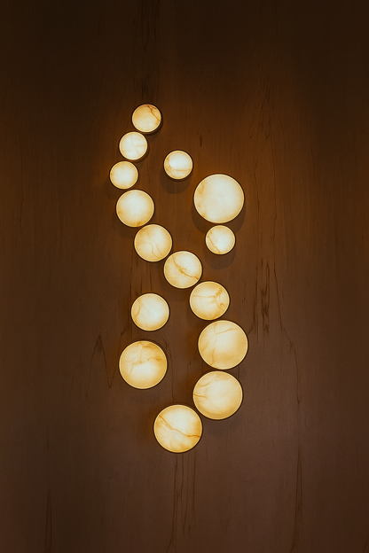 These beautiful alabaster clusters or pendant lights are magnificent as a floating wall or ceiling canopy. Made bespoke for your project in any size. This modern lighting design can be customized to fit any space, adding a touch of elegance and sophistication to your home or business. With an adjustable dimmer control, you can easily adjust the brightness to any setting.