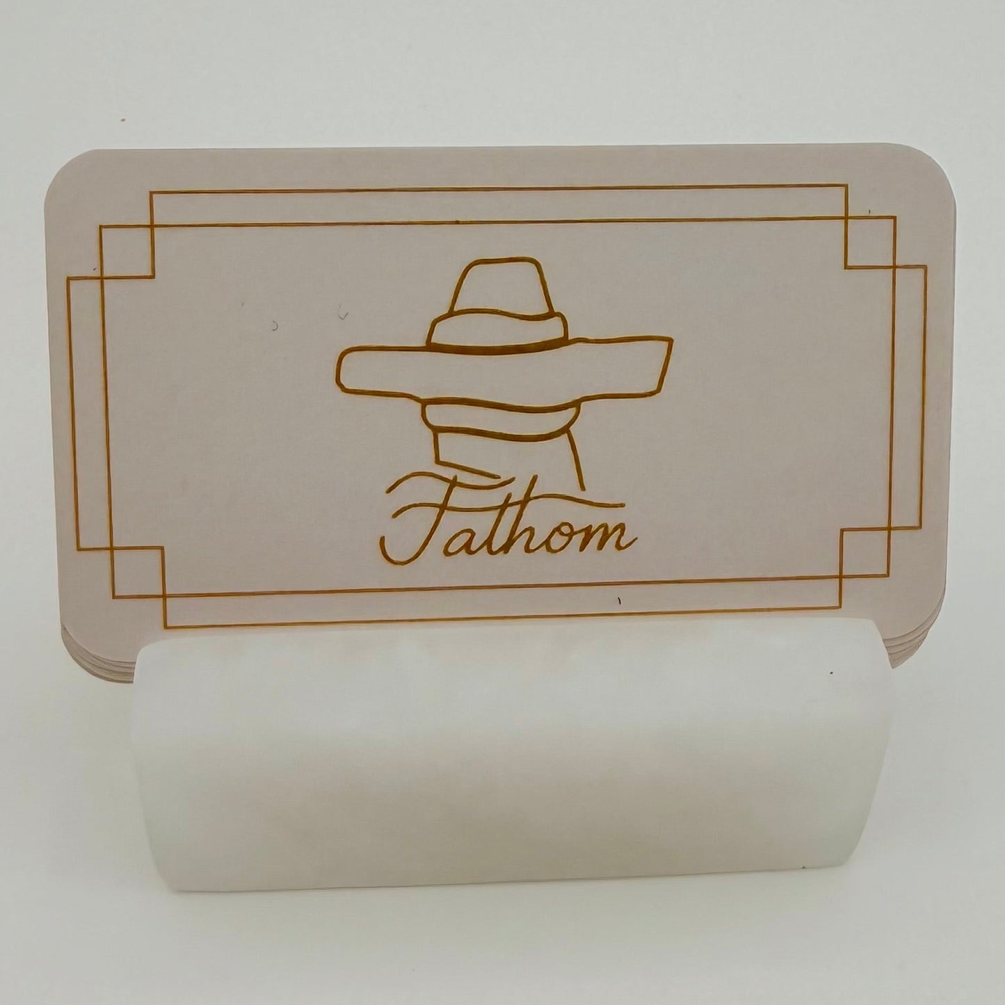 Card with a logo and text 'Fathom' on a white background
