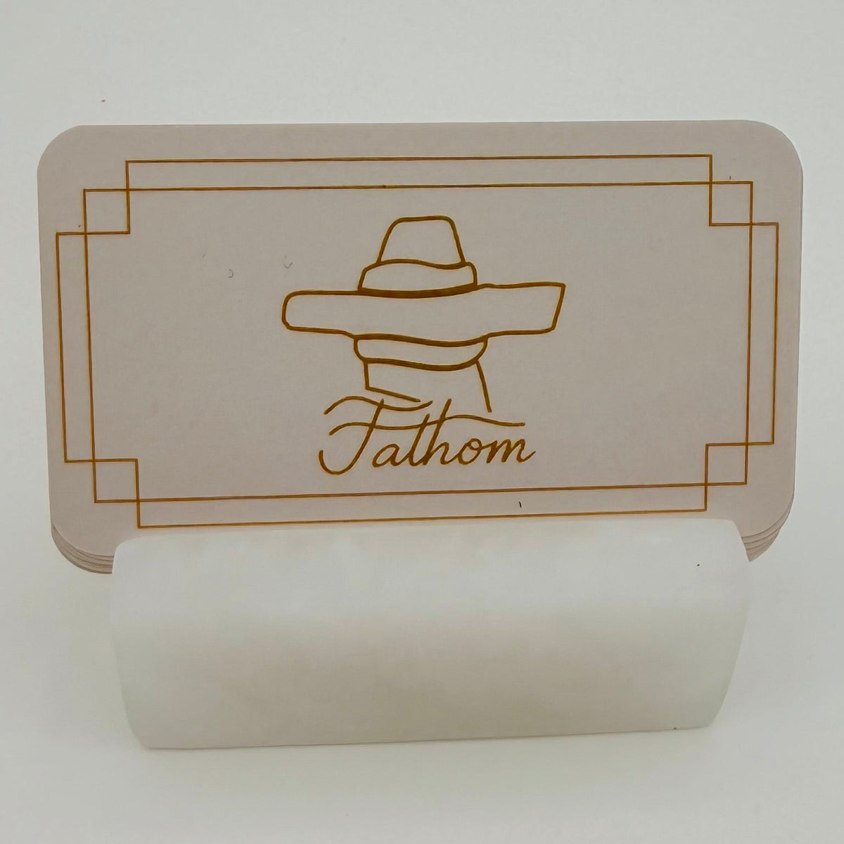 Card with a logo and text 'Fathom' on a white background