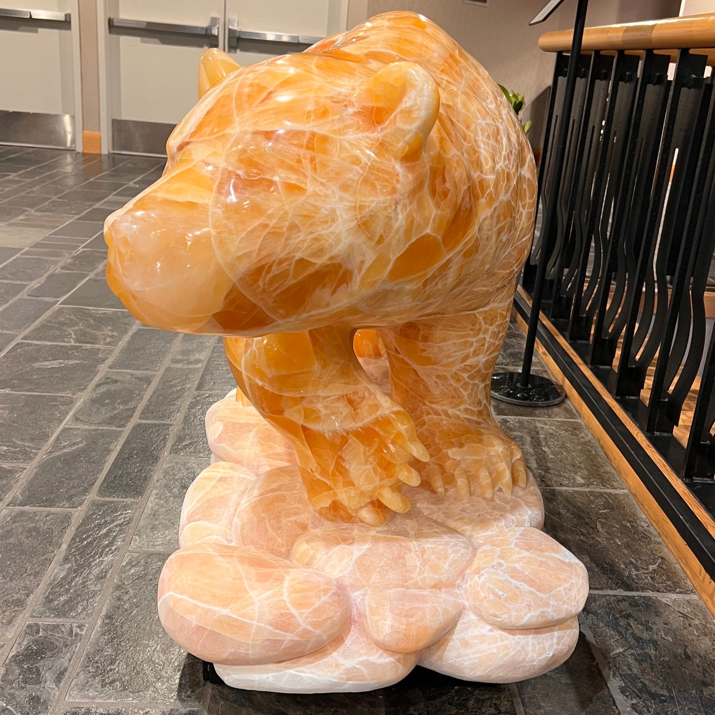 Gold Strike — Honeycomb Calcite Grizzly Walking On River Stone