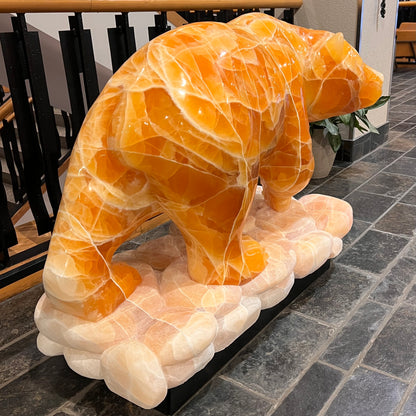 Gold Strike — Honeycomb Calcite Grizzly Walking On River Stone