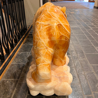 Gold Strike — Honeycomb Calcite Grizzly Walking On River Stone