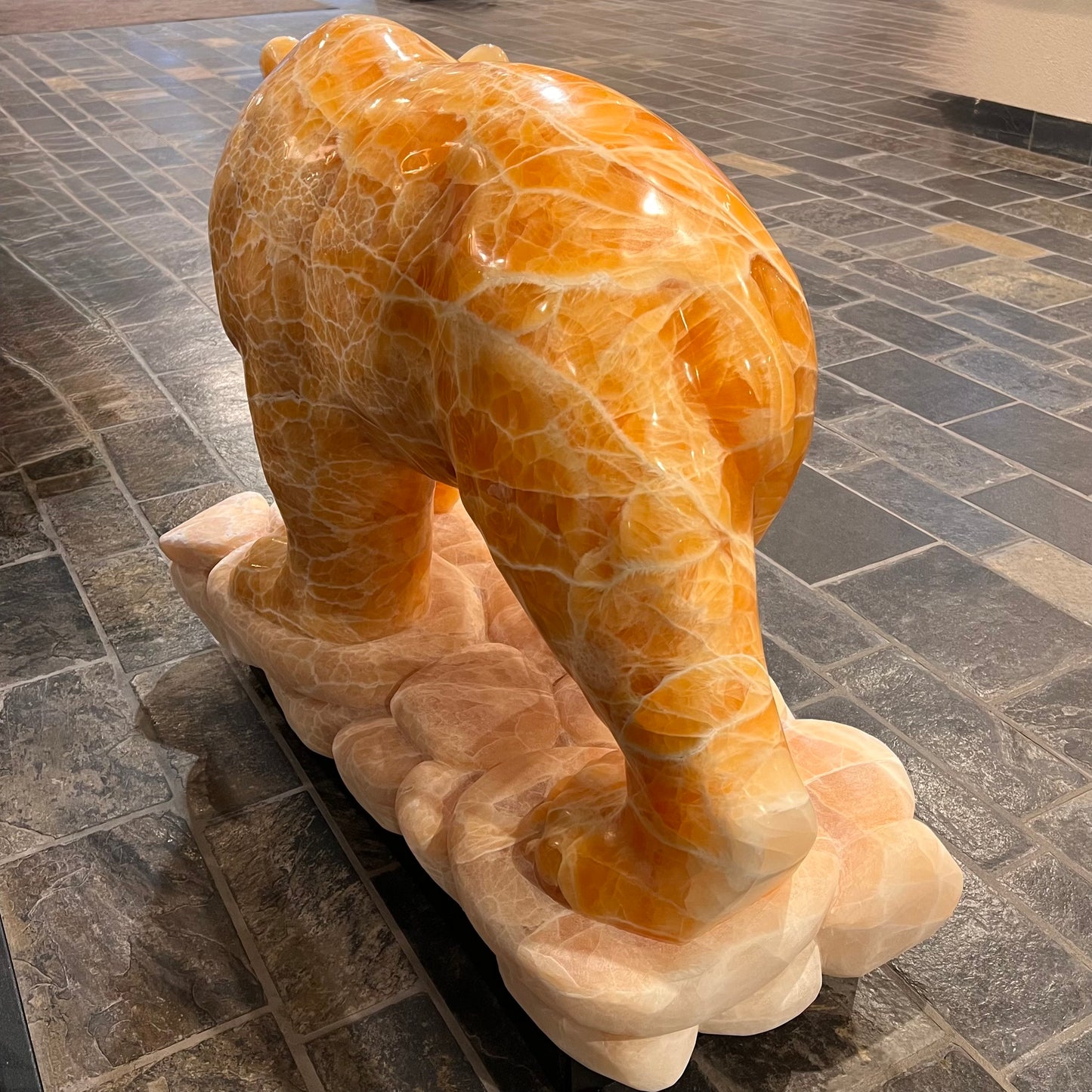 Gold Strike — Honeycomb Calcite Grizzly Walking On River Stone