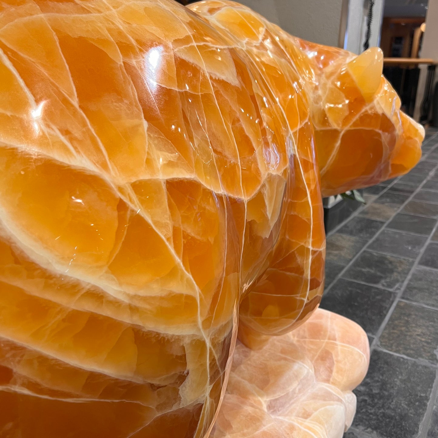 Gold Strike — Honeycomb Calcite Grizzly Walking On River Stone