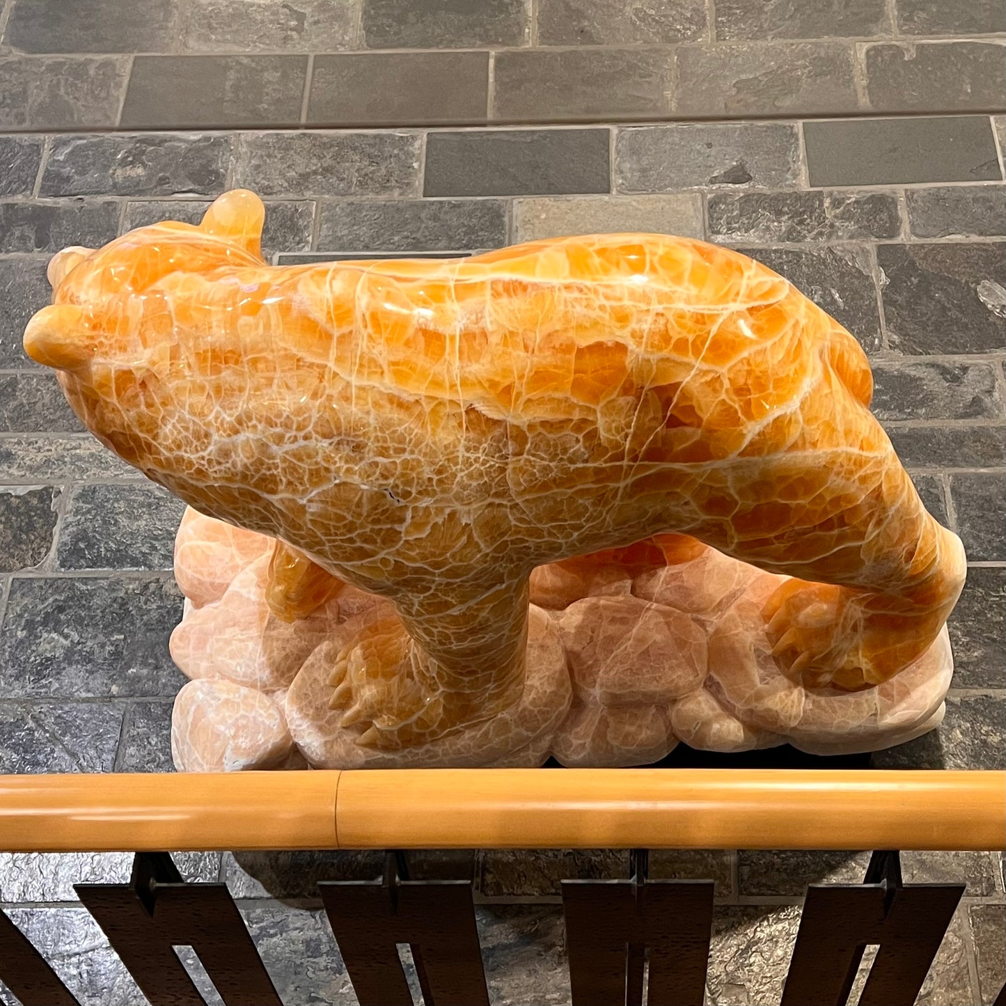 Gold Strike — Honeycomb Calcite Grizzly Walking On River Stone