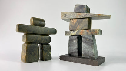 A photo of two different inukshuk art classes, one is a carved inukshuk and the other is a stacked inukshuk art class.