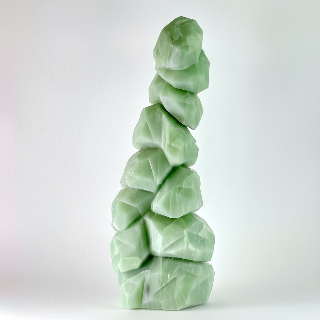 Discover the serene beauty of British Columbia's winter landscape captured in hand-carved stone. This striking Emerald Snow Tree sculpture showcases intricate detail work, with delicate snow-laden branches emerging from rich emerald tones. This piece is uniquely carved, making it a one-of-a-kind artistic treasure. Perfect for nature lovers and art collectors seeking authentic Canadian craftsmanship, this sculptural work brings the tranquility of snowy forests into your home or gallery space. A timeless inv
