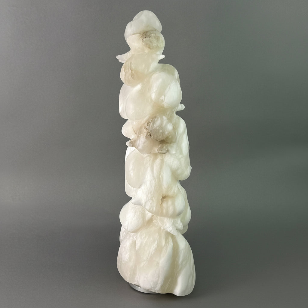 White marble sculpture of a figure of a snowy tree