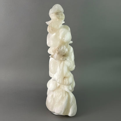 White marble sculpture of a figure of a snowy tree