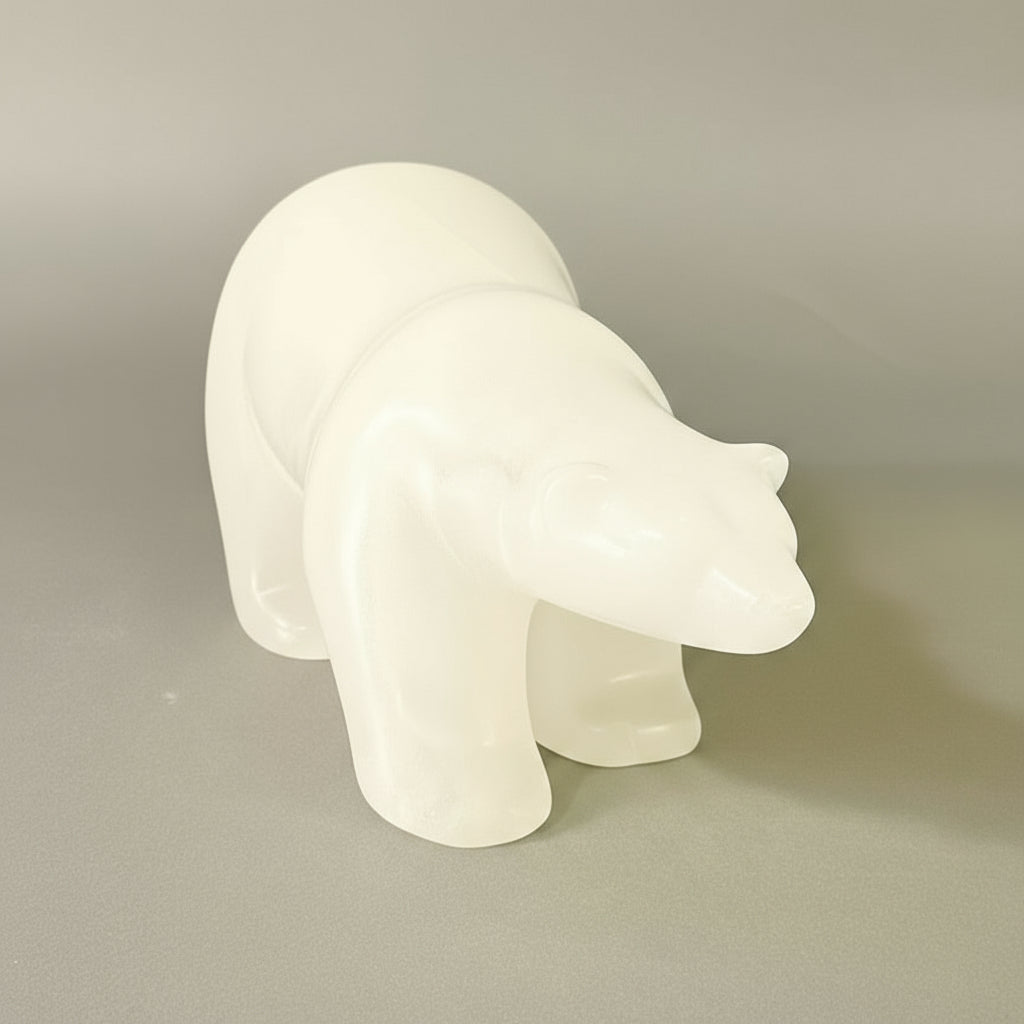Embrace the serene beauty of winter with this hand-carved sculpture crafted from pristine ice alabaster. Its minimalist palette and delicate, barely-tinted surface evoke the crisp purity of freshly fallen snow. The piece captures the quiet elegance of the coldest season, bringing an understated sophistication and natural tranquility into your home. Perfect for those who appreciate refined, understated artistry.