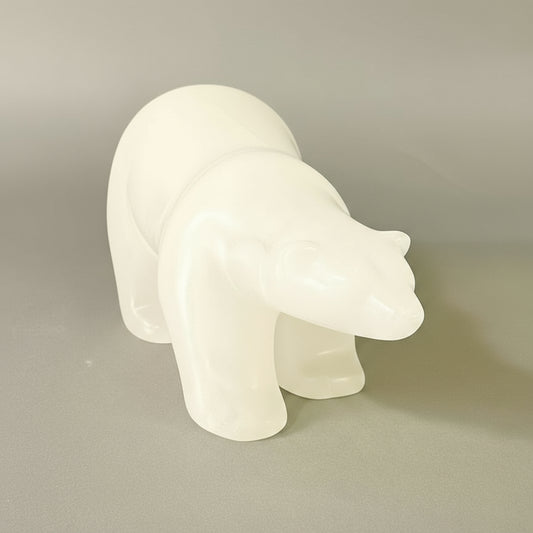 Embrace the serene beauty of winter with this hand-carved sculpture crafted from pristine ice alabaster. Its minimalist palette and delicate, barely-tinted surface evoke the crisp purity of freshly fallen snow. The piece captures the quiet elegance of the coldest season, bringing an understated sophistication and natural tranquility into your home. Perfect for those who appreciate refined, understated artistry.