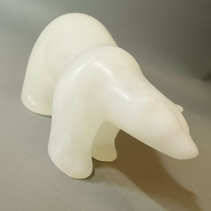 White polar bear sculpture on a gray background