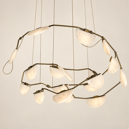 A modern spiral alabaster stone chandelier with a dark brass metal frame and multiple curved, semi-circular off-white glass shades suspended by thin cords against a plain light beige background.