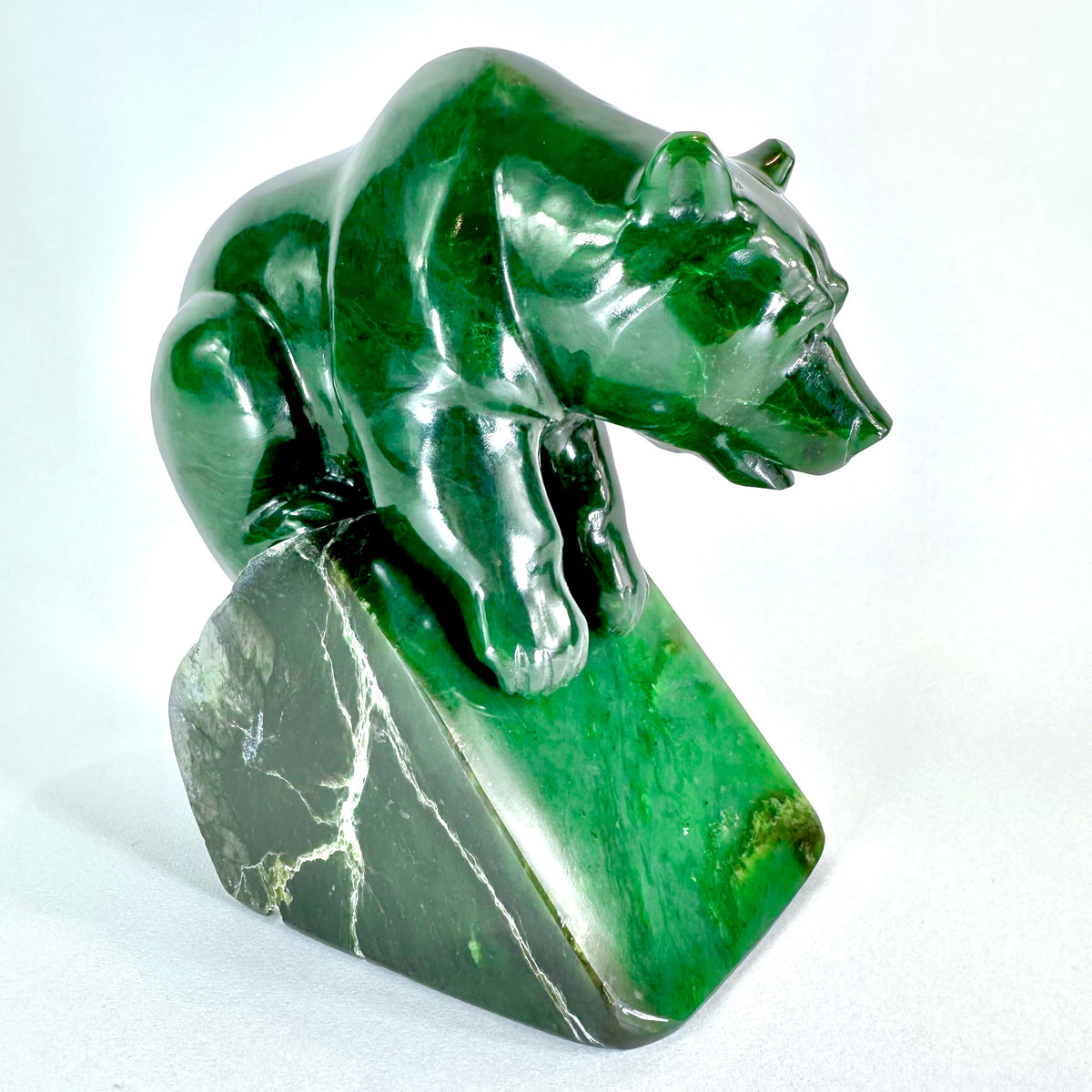 Green BC Jade stone bear sculpture on a white background