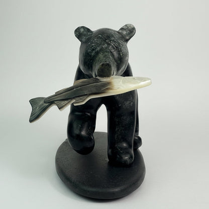 brucite bear holding a salmon
