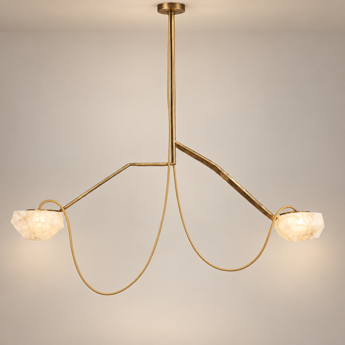 A modern alabaster two-light pendant chandelier with a brushed gold metal frame and faceted white stone shades, suspended against a neutral light gray background.