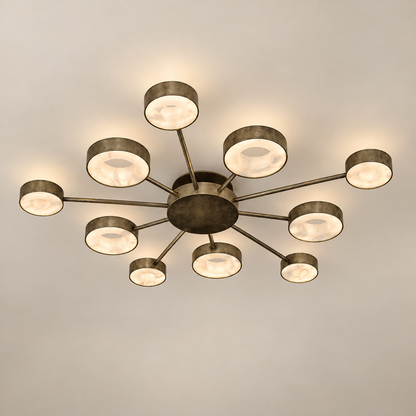 A modern multi-light hand carved alabaster stone light ceiling fixture with a bronze-finished metal frame and multiple circular glass shades, shown installed on a plain light gray ceiling.