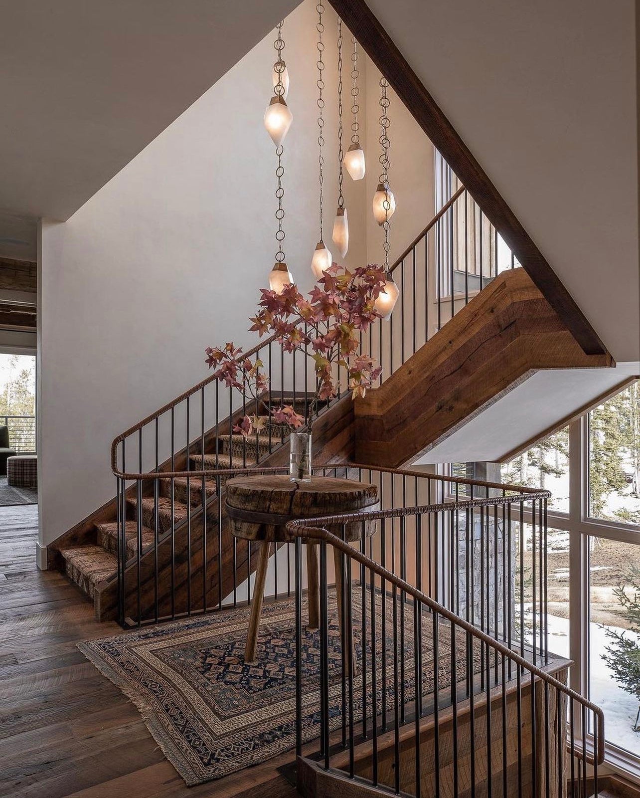 Natural Alabaster Stone Lights hung in the staircase bring art and light to the room.  Randy Zieber Lights are at Fathom Stone Art.