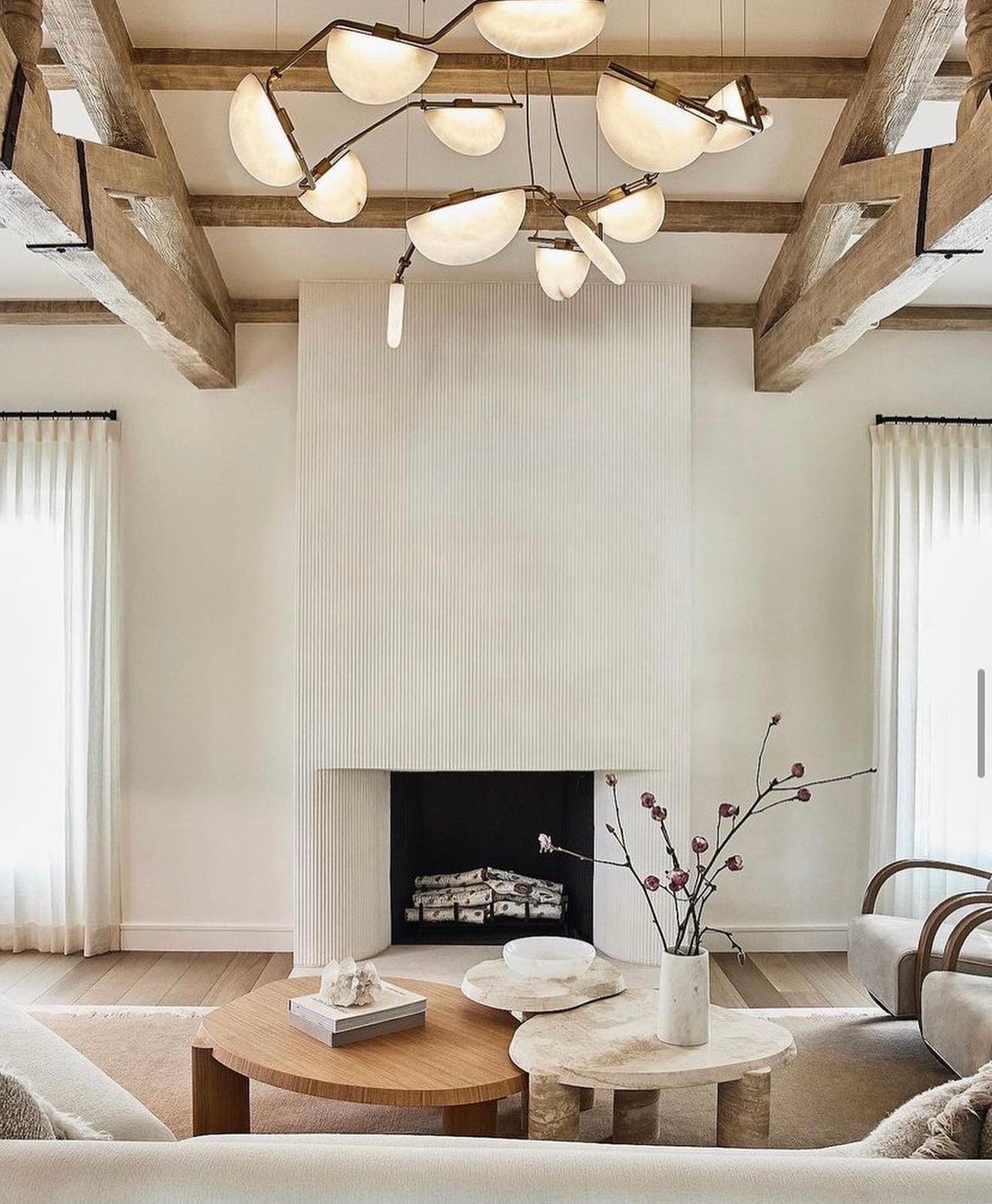 Alabaste lighting looks fabulous with wood beams running through a room.