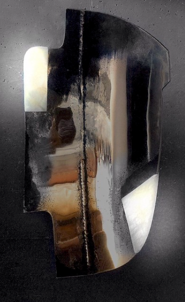 This antiqued welded brass with backlit alabaster is genius and modern.