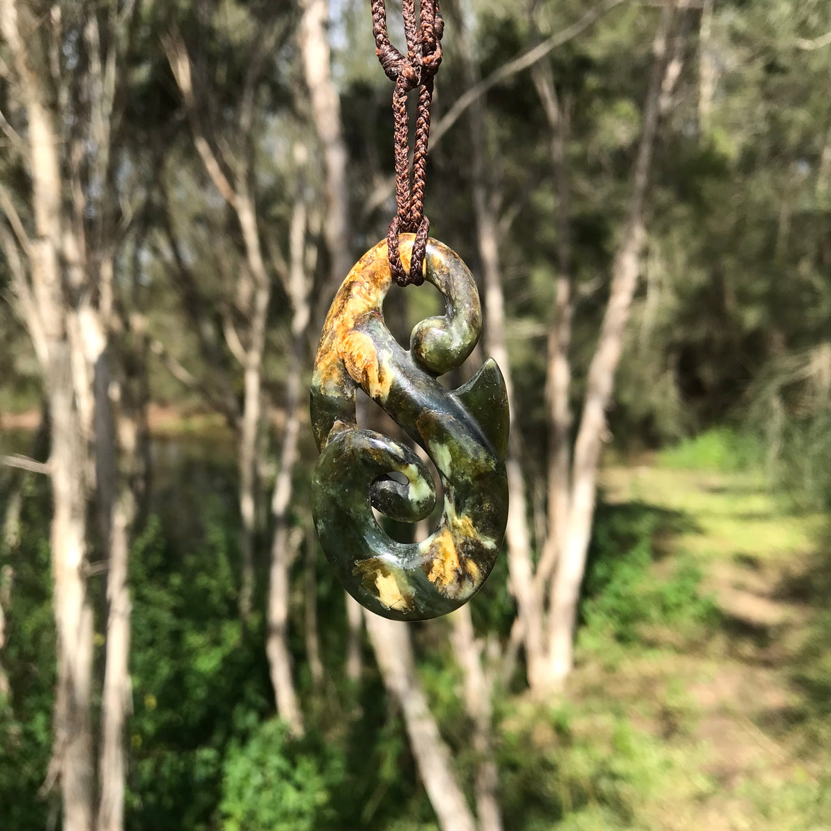 Double Koru (Canadian jade) – stone sculpture