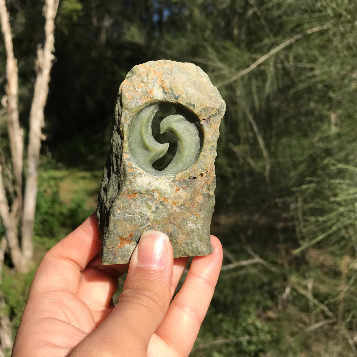 Carved paperweight (Canadian jade) – stone sculpture