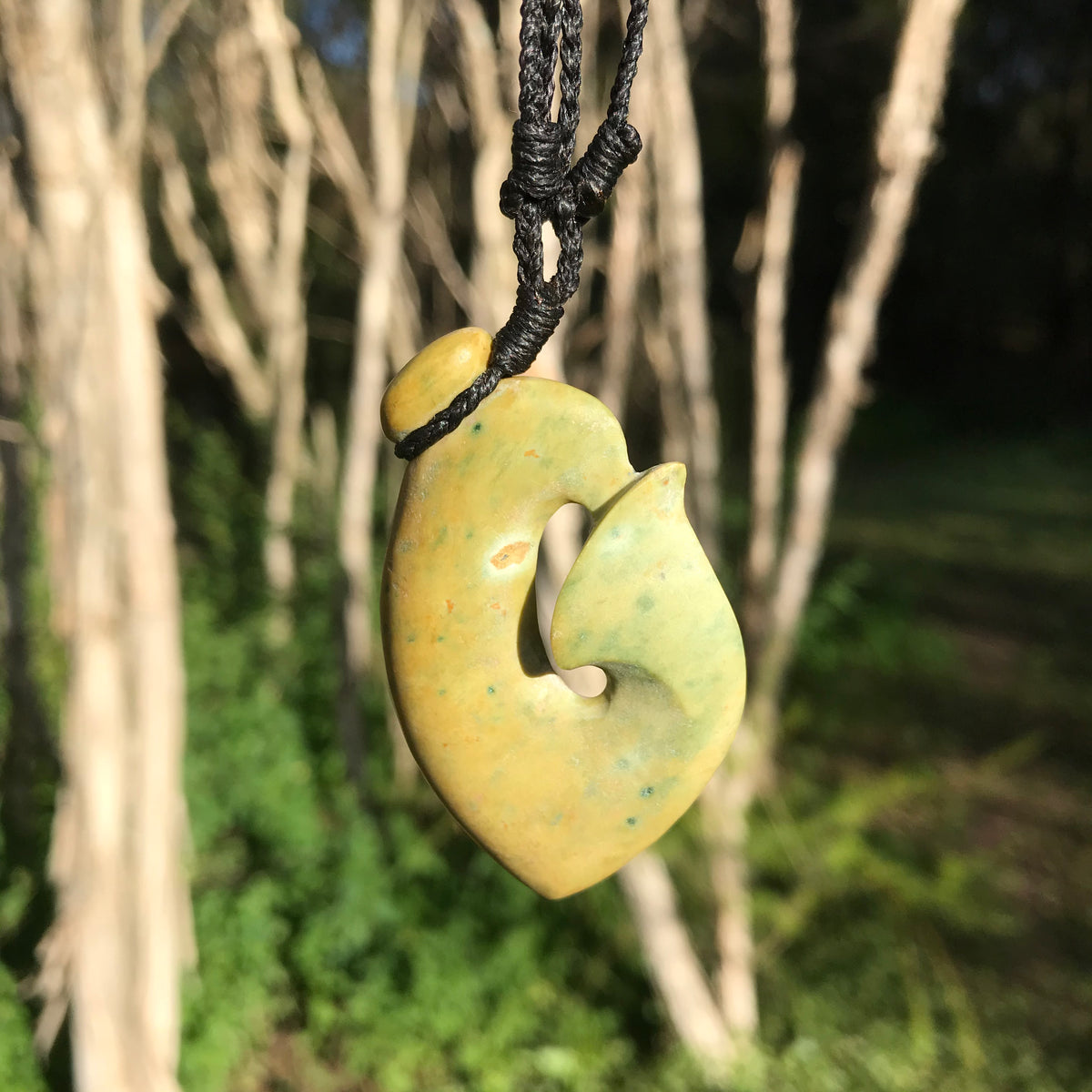Hei Matau (New Zealand flower jade) – stone sculpture
